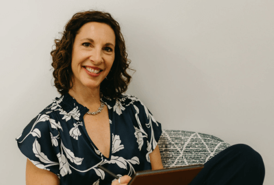 Jennifer Gilman sitting taking notes